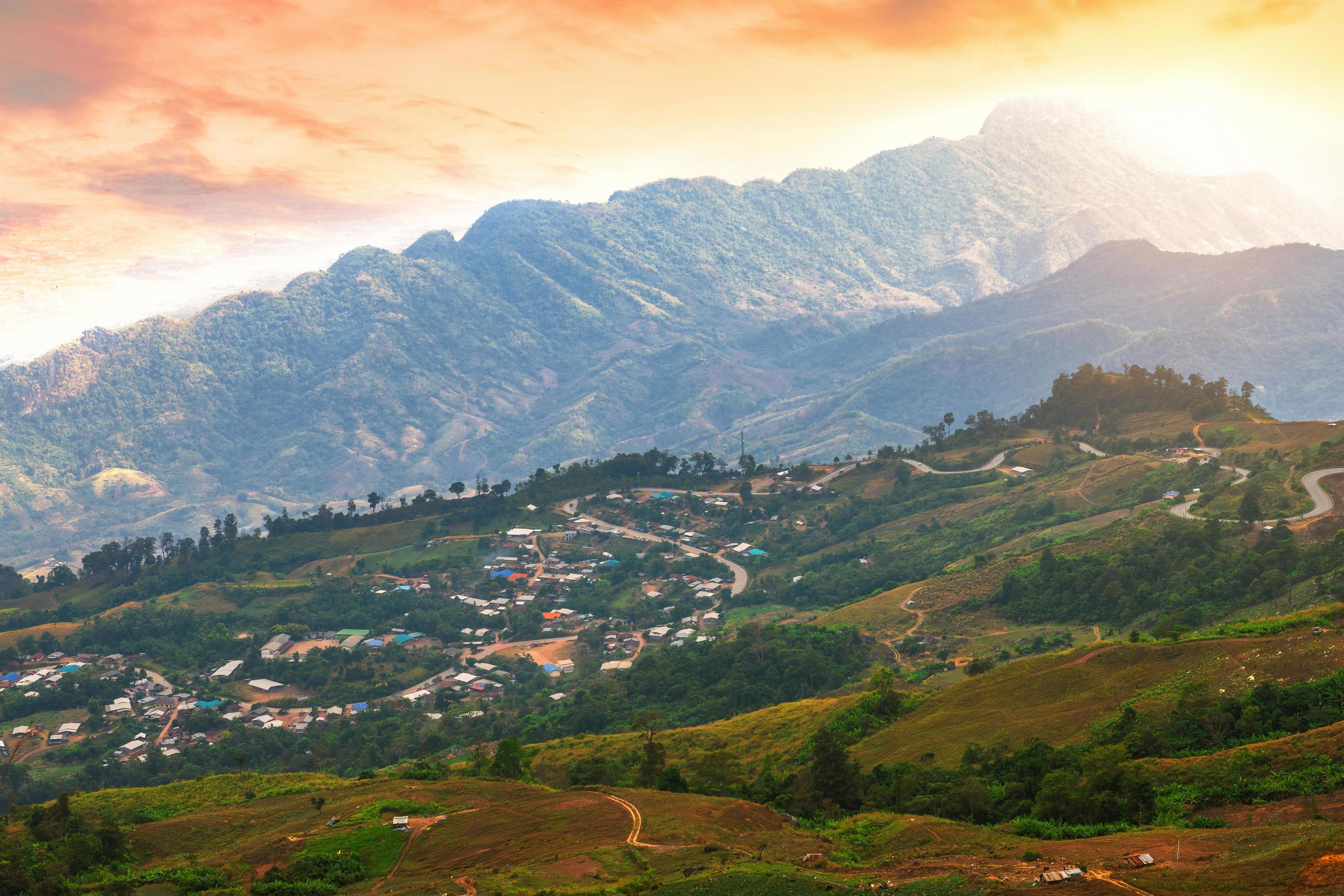 Sunset of Panoramic view mountain range with village on Nature Trail in Phu Thap Buek National Park in Phetchabun, Thailand. Stock Free