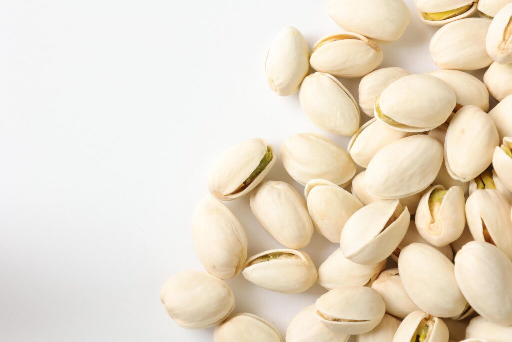 Pistachios nuts seeds on white background Stock Free