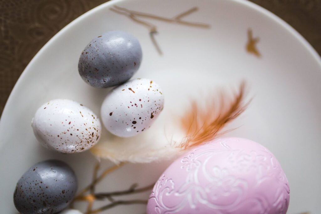 Easter table with cute pink decorations, flowers, catkins and eggs Stock Free