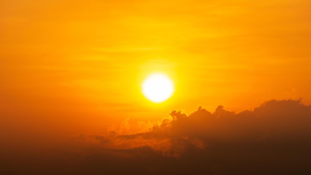 Bright sun and cloud on orange sky natural background Stock Free