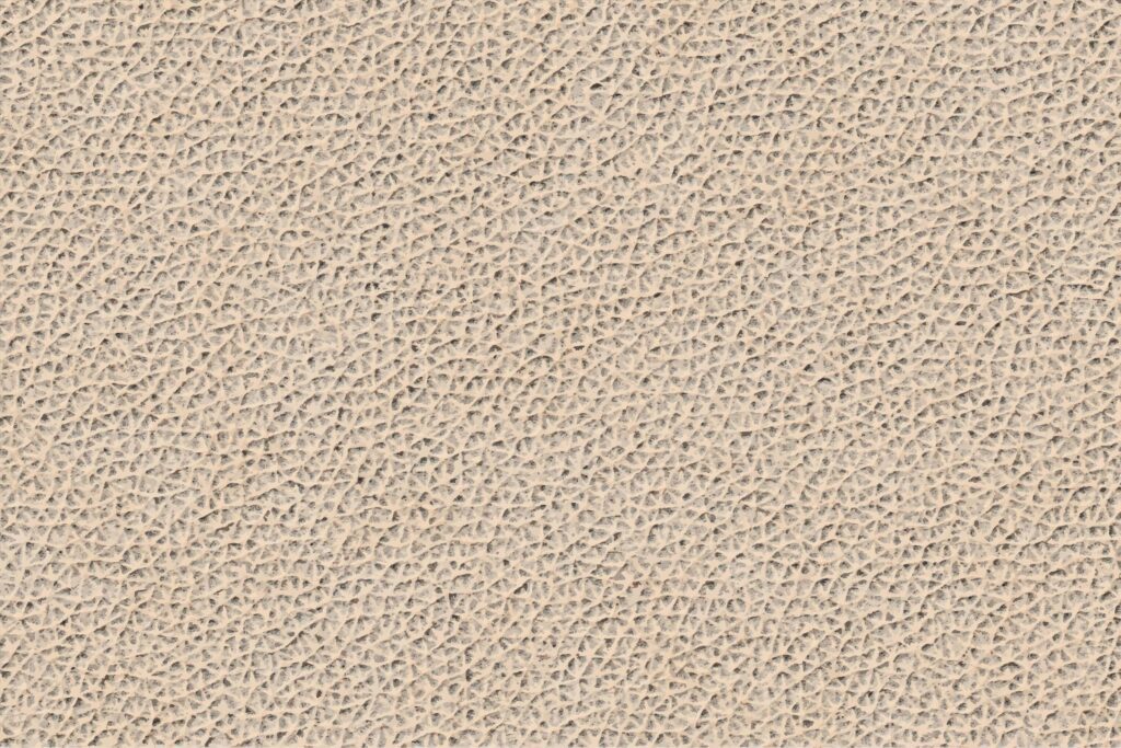 hand tipped almond leather texture background Stock Free