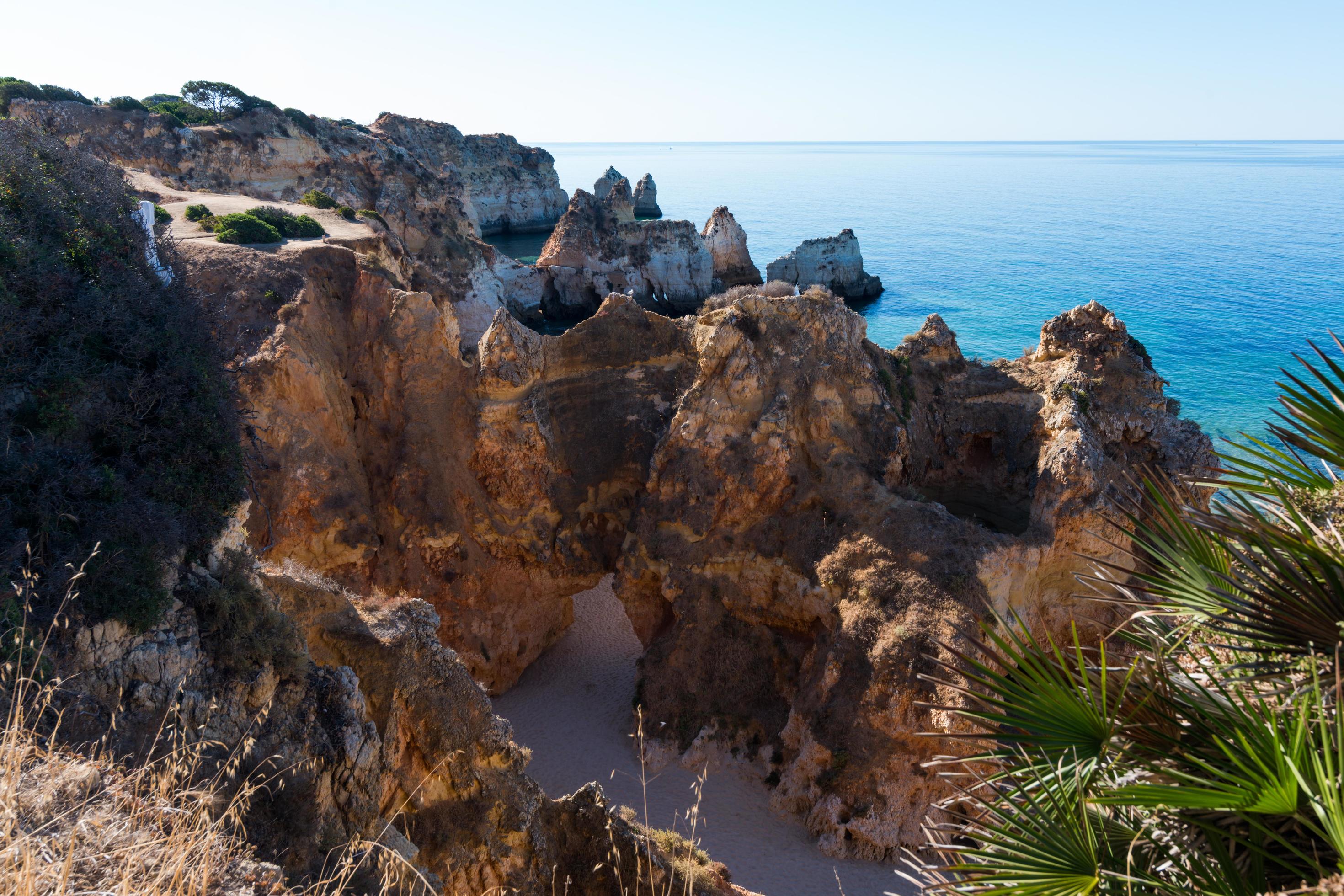 Beach at Algarve with natural limestone with beautiful shapes. Portugal Stock Free