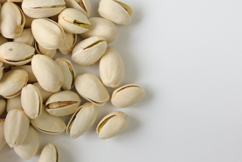 Pistachios nuts seeds on white background Stock Free