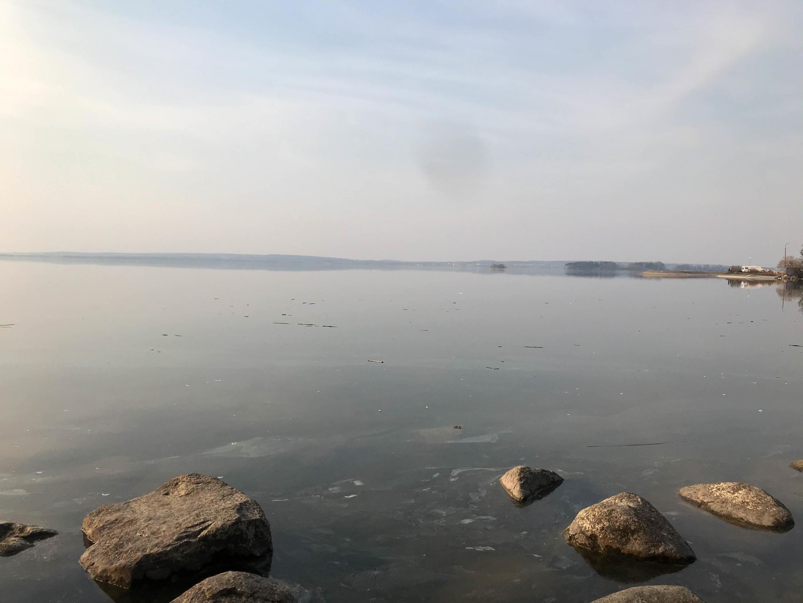 Large round beautiful natural stones cobblestones in water, sea, lake, river. Background, texture Stock Free