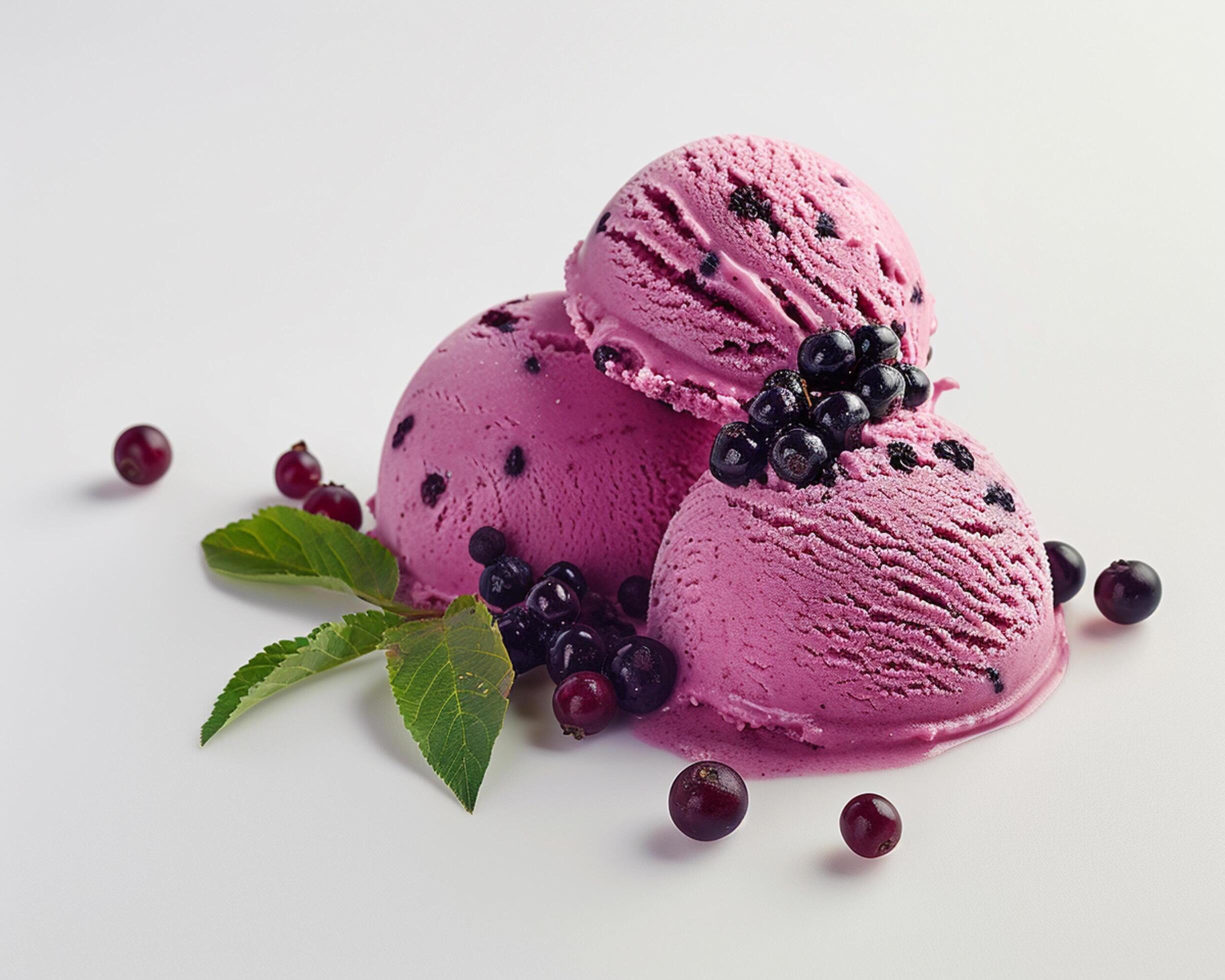 three scoops of ice cream with berries on a white background Stock Free