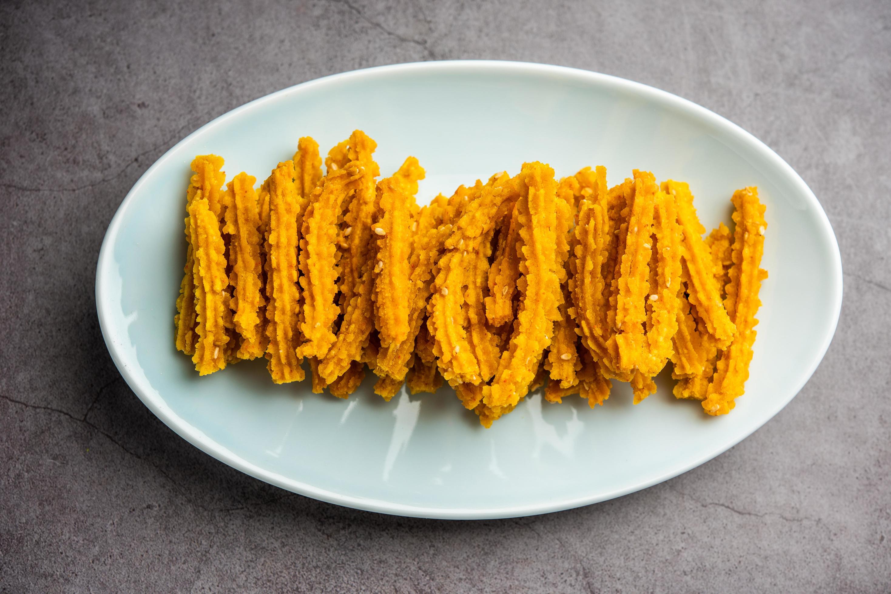 Bhajni chakli sticks or crunchy murukku snack made using diwali festival, favourite munching food Stock Free