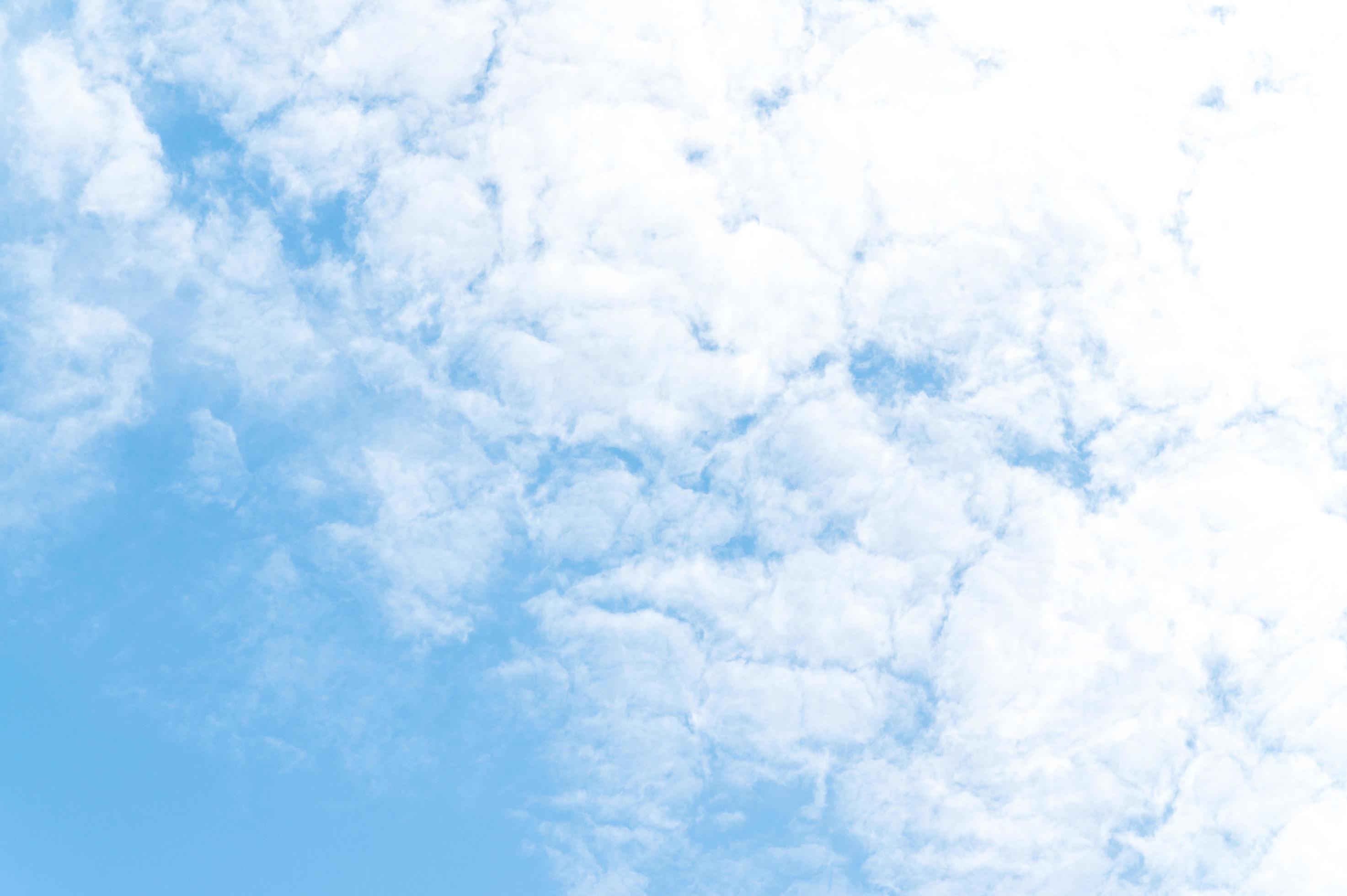 Beautiful white fluffy clouds in blue sky. Nature background from white clouds in sunny day Stock Free