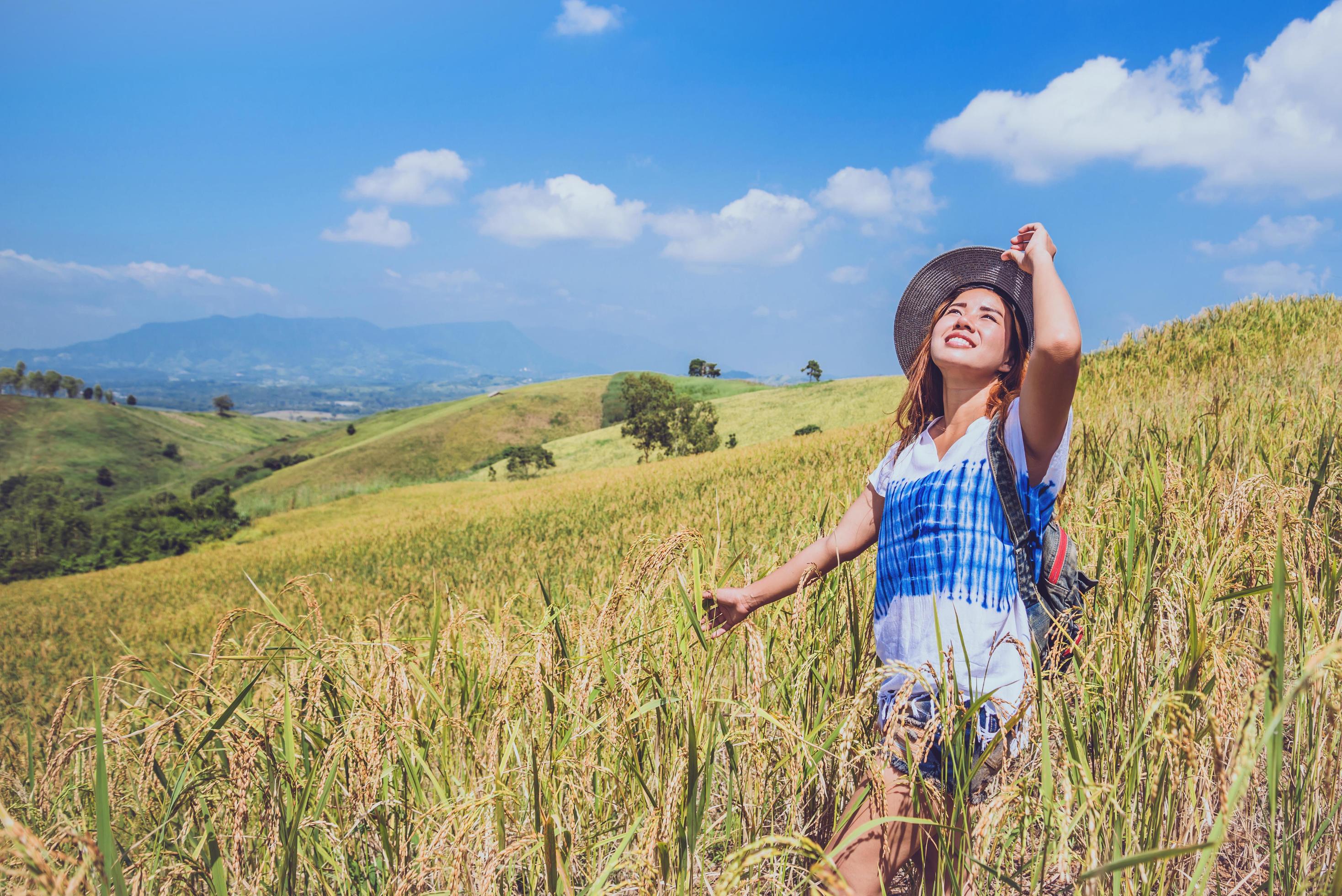 Asian women travel relax in the holiday. Stand natural touch mountain field. Thailand Stock Free