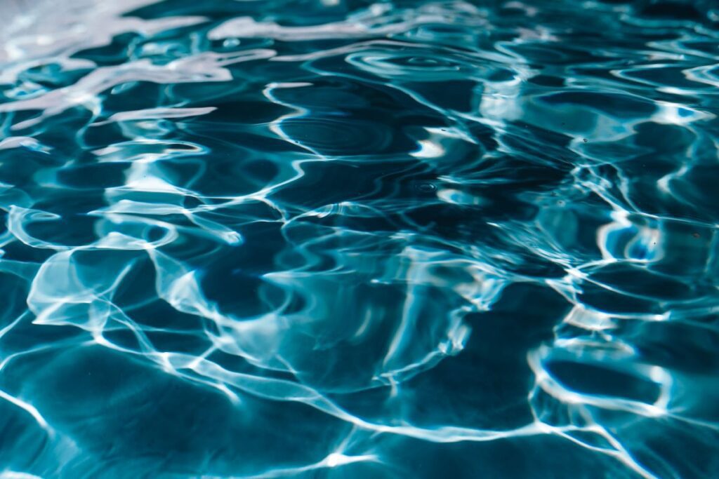 Wavy water surface in a swimming pool Stock Free