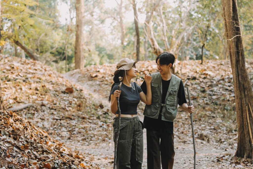 Asian couple sweet in tent inside on they camping trip, traveller relax and sleep togather in out door and camping trip Stock Free