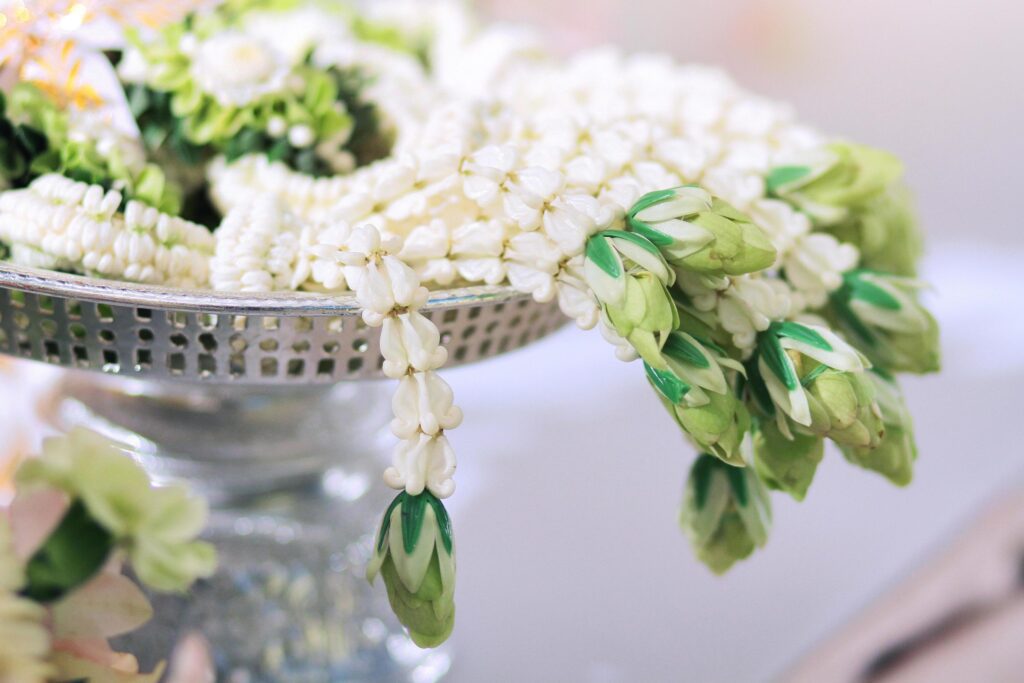 Flower garlands on a gold tray in tradition Thai wedding ceremony day. Jasmine garland Stock Free