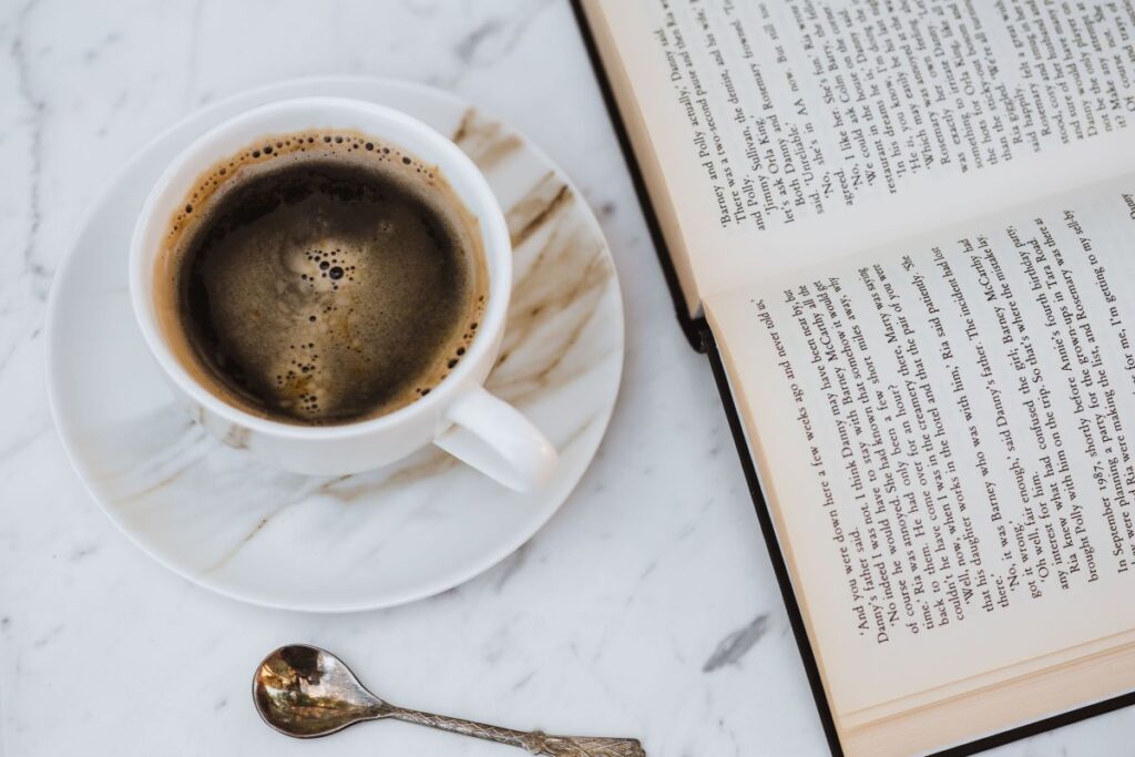 Cup of Coffee and an Open Book Stock Free