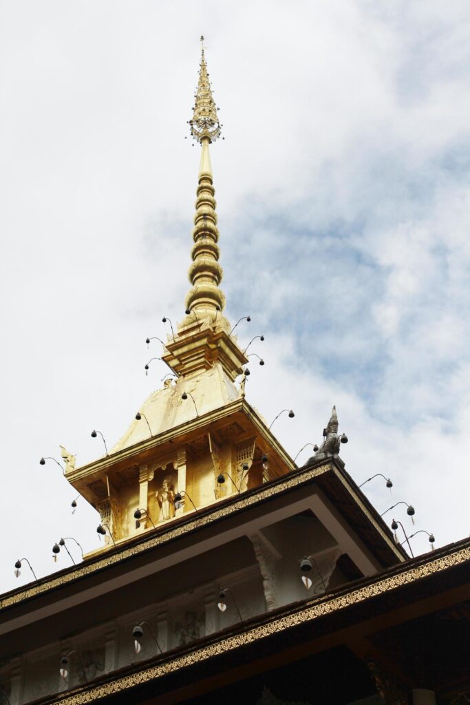 Golden pagoda and naga in temple of Thailand Stock Free