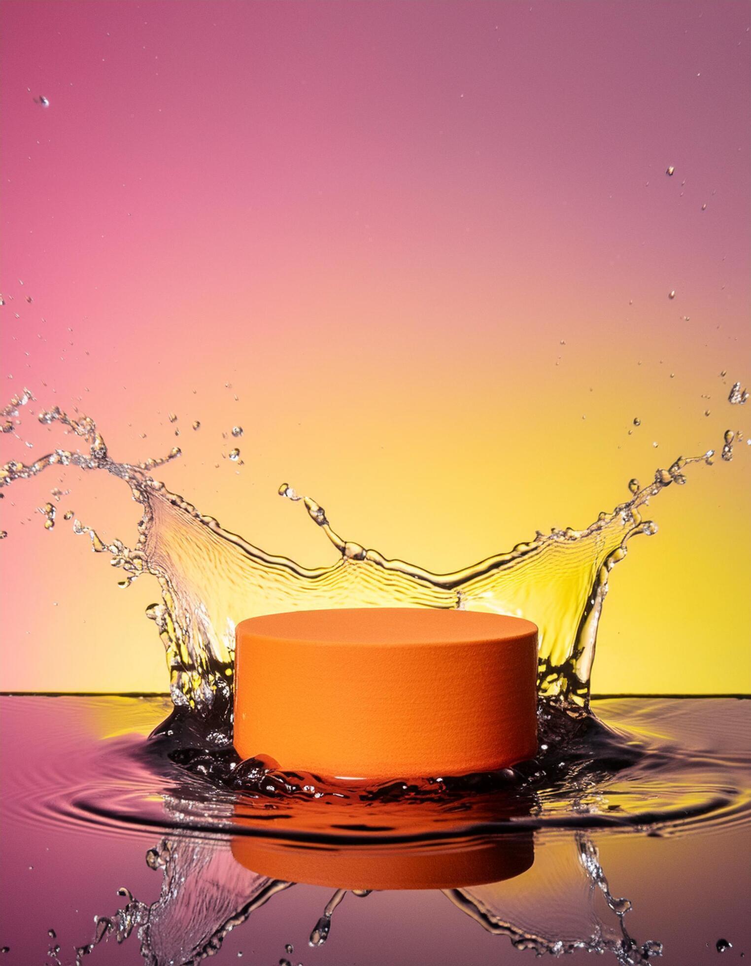 empty orange podium mockup with water splash on a gradient background for product display Stock Free