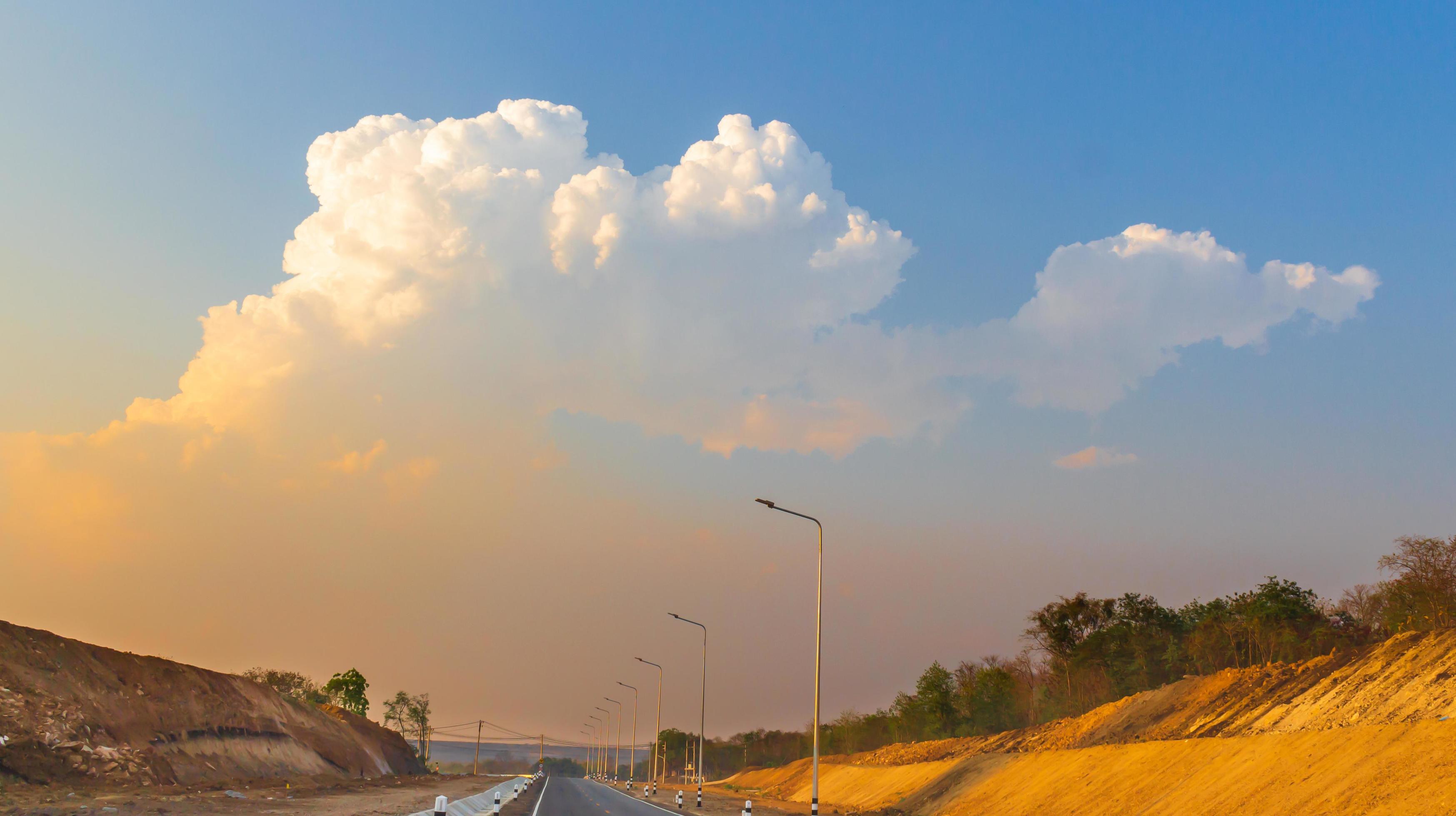 natural light of sky clouds and country roads Stock Free