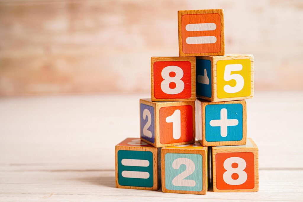 Number wood block cubes for learning Mathematic, education math concept. Stock Free