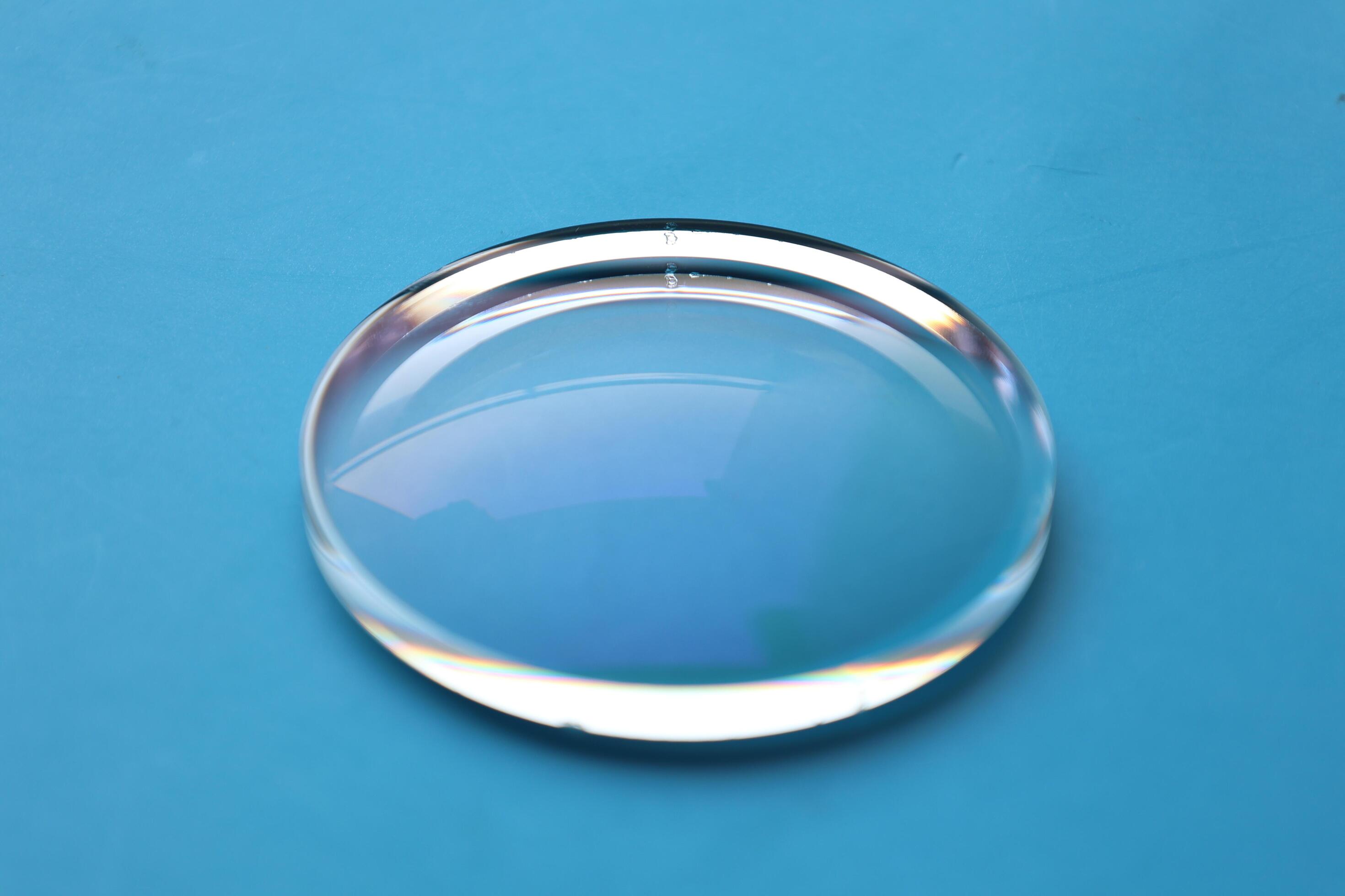 Eyeglasses lens production industry, close-up eyeglasses lenses, eyeglasses lenses, eyeglasses lenses, eyeglasses store business concept Stock Free