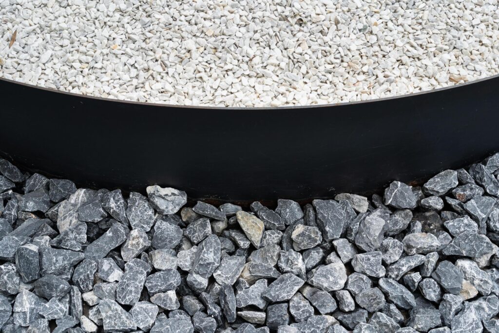 Limestone light crushed stone close up. loose gravel, construction and mining business. Stock Free