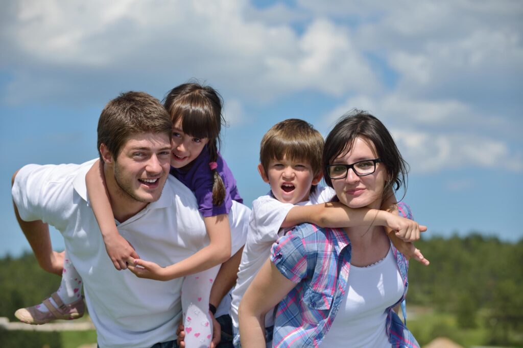 happy young family have fun outdoors Stock Free