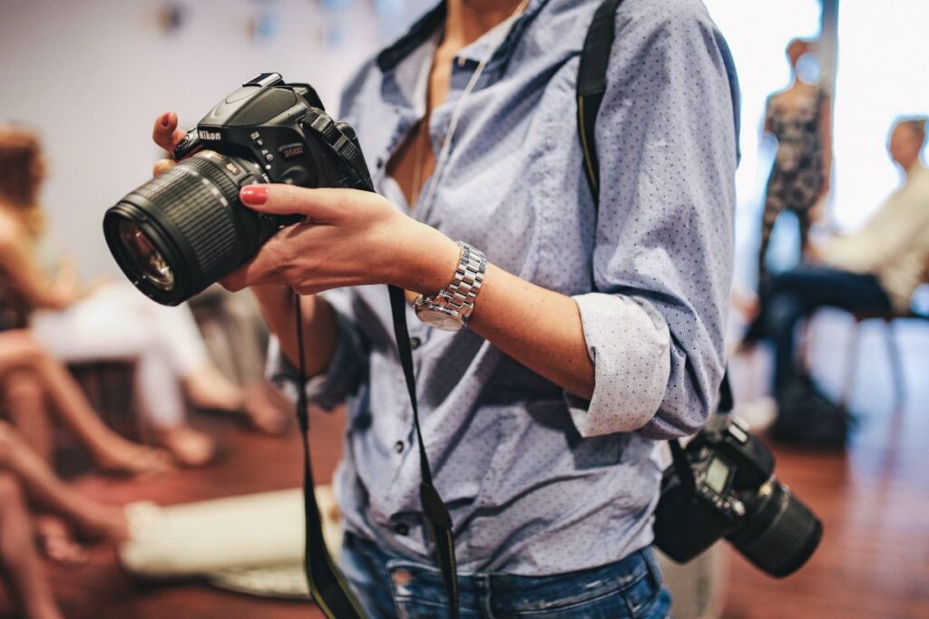 People with cameras at an exhibition Stock Free