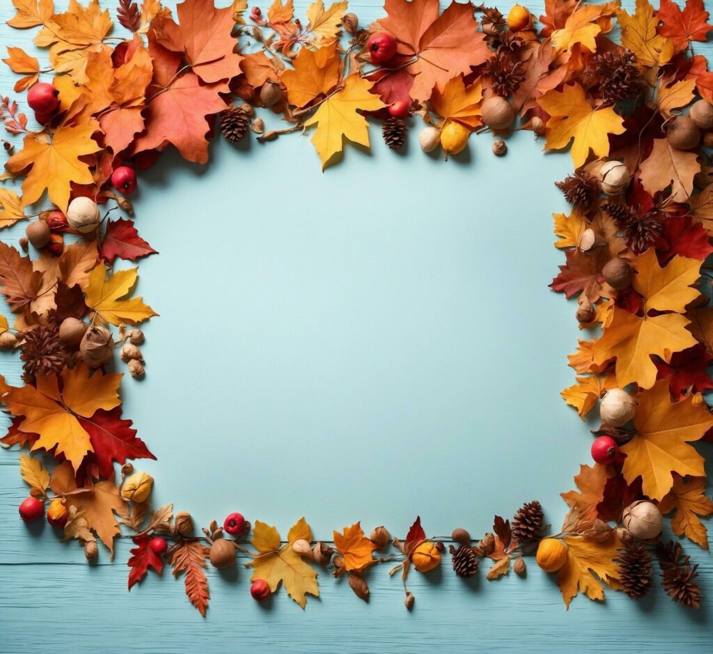 Autumn leaves frame on blue background. Top view with copy space Free Photo