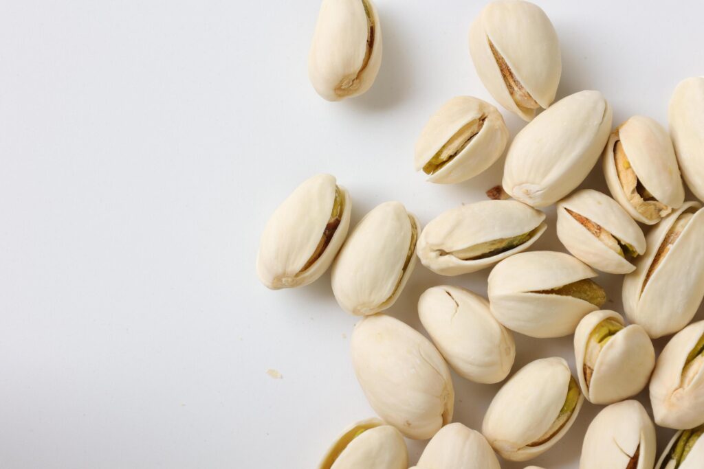 Pistachios nuts seeds on white background Stock Free