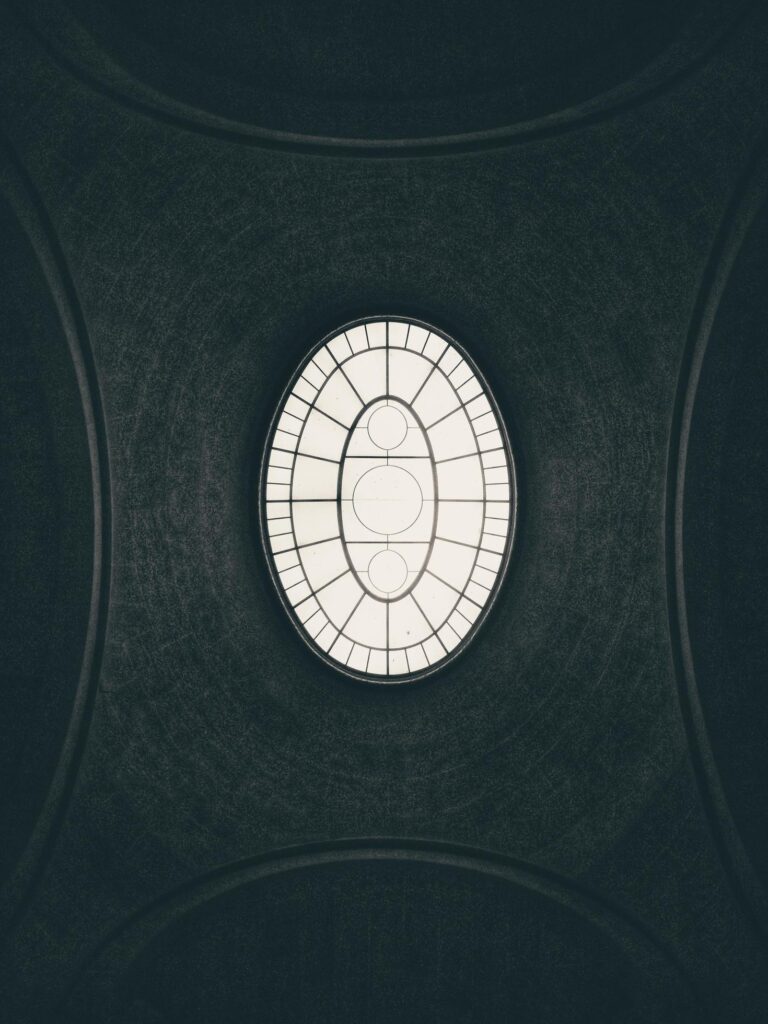 Low angle view of geometric skylight Stock Free