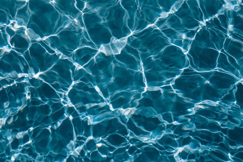 Wavy water surface in a swimming pool Stock Free