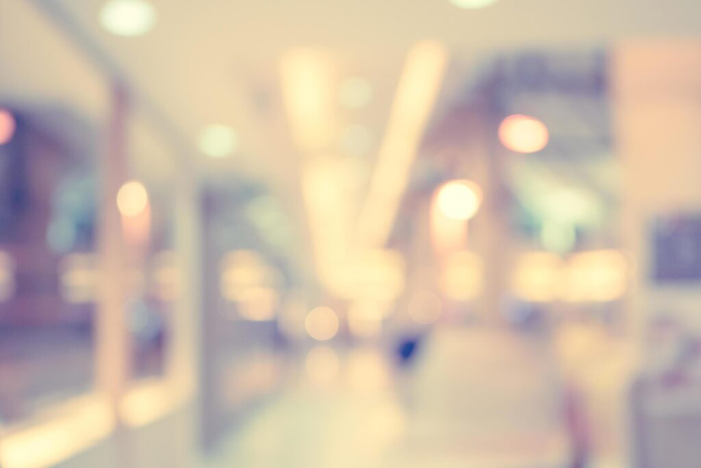 Blurred background, people at shopping mall blur background with bokeh and vintage tone. Stock Free