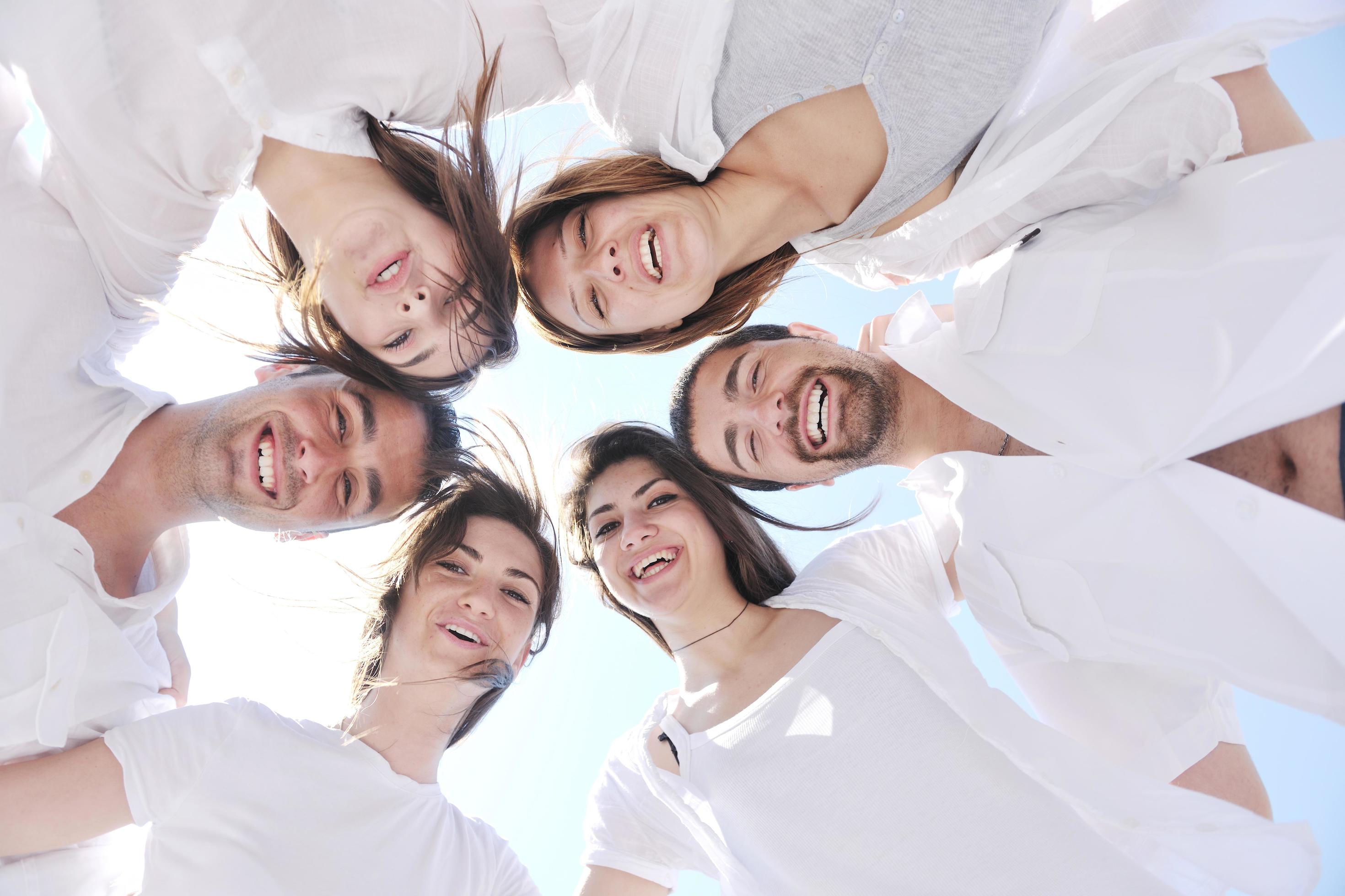 Group of happy young people in have fun at beach Stock Free