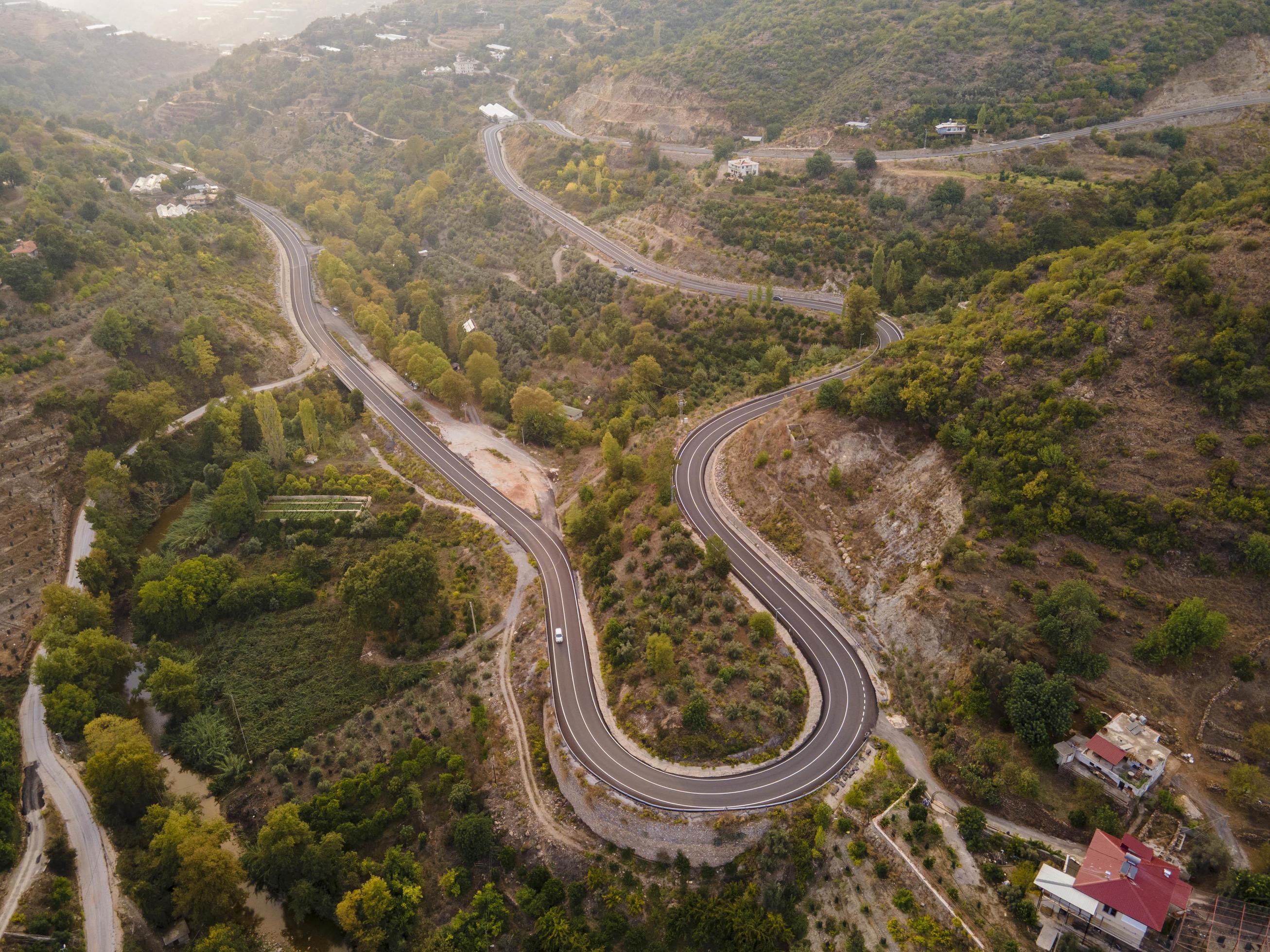 aerial valley and road, Top view, amazing nature background. sunset Flying drone, seascape Stock Free