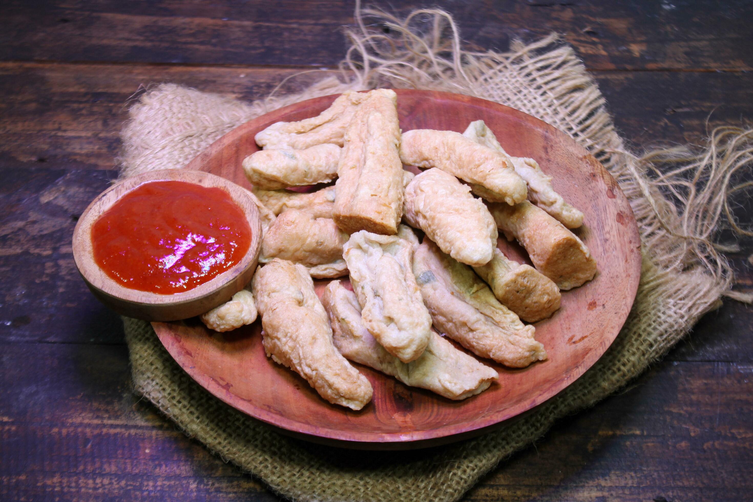 Otak otak a traditional food made from fish and served with served with chili sauce Stock Free