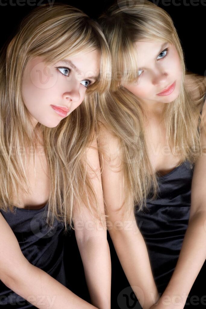 Portrait of the young blonde near a mirror Pro Photo