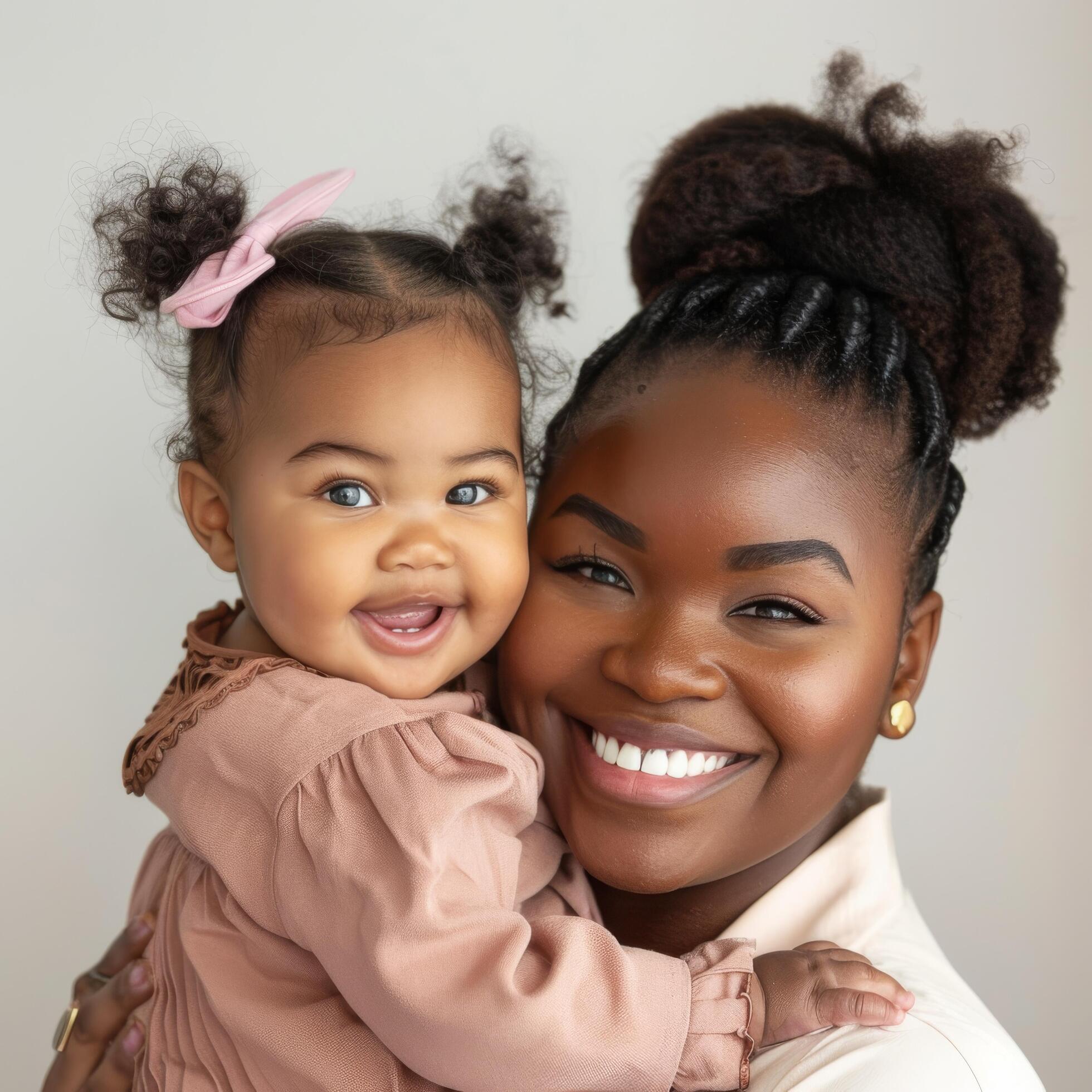 Mother holding her happy toddler suitable for family-themed content and advertising Stock Free