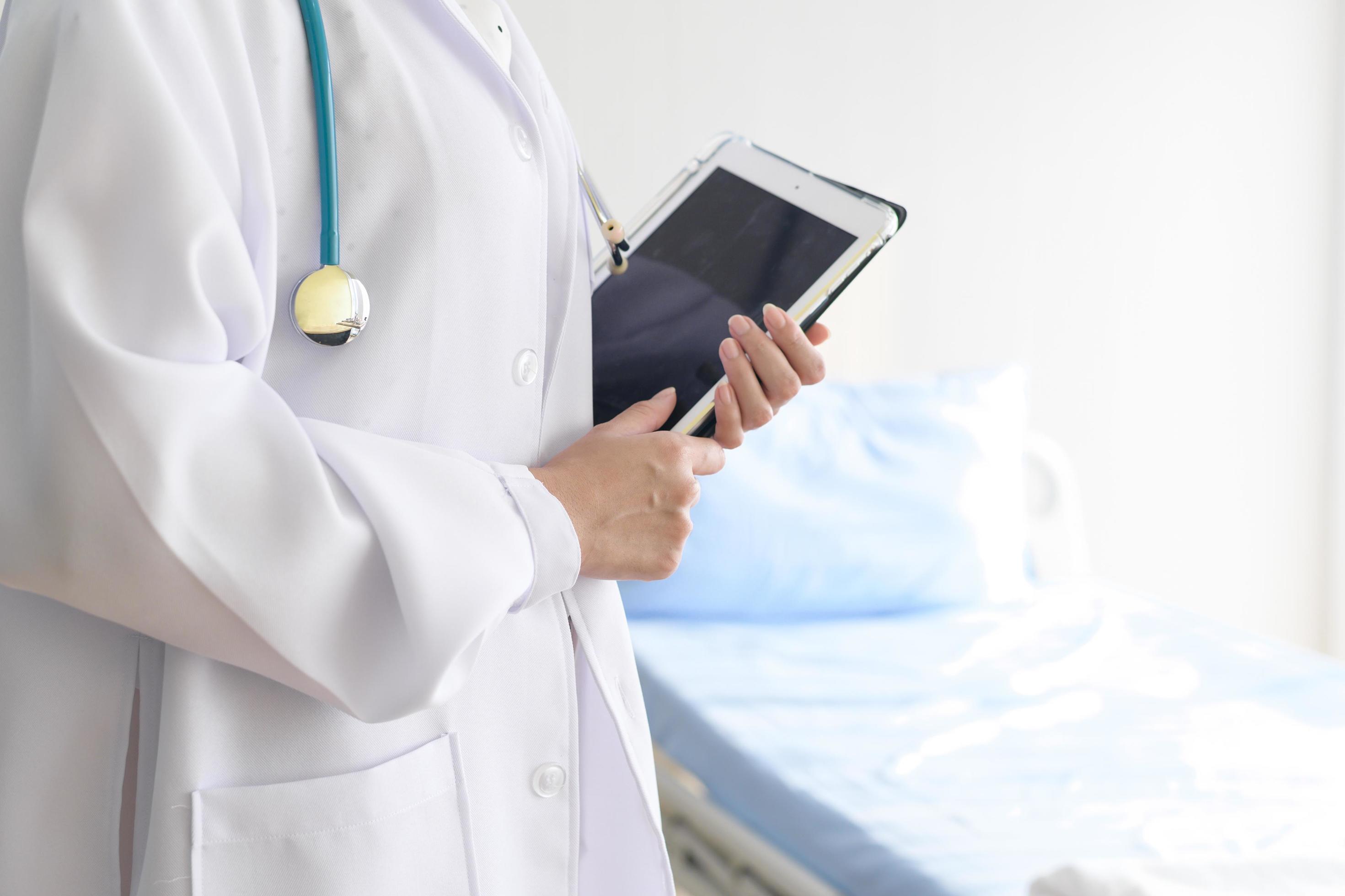 Portrait of young female doctor with stethoscope working at hospital, medical and health care concept Stock Free