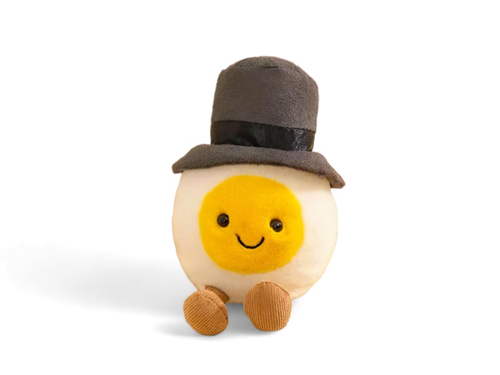 Egg doll wearing a hat on a white background Stock Free