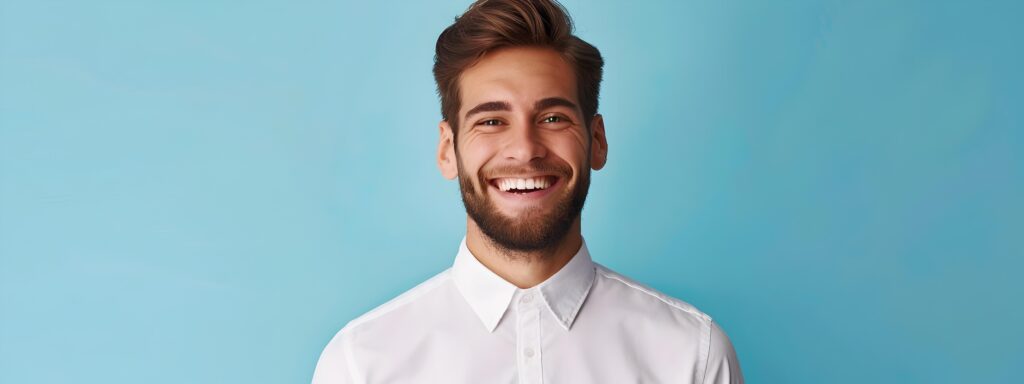 Cheerful Young Business Manager Posing in Colorful Studio Stock Free