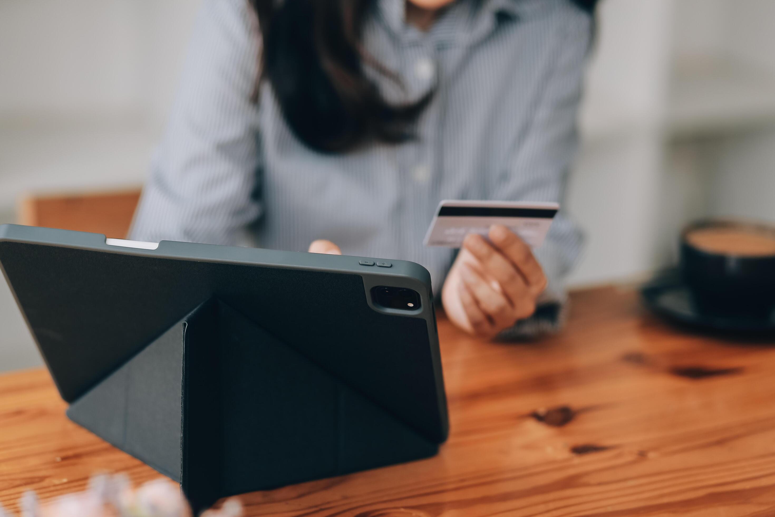 Happy asian woman using smartphone shopping online with credit card. Lifestyle. Easy pay using smart phone or digital device. Stock Free