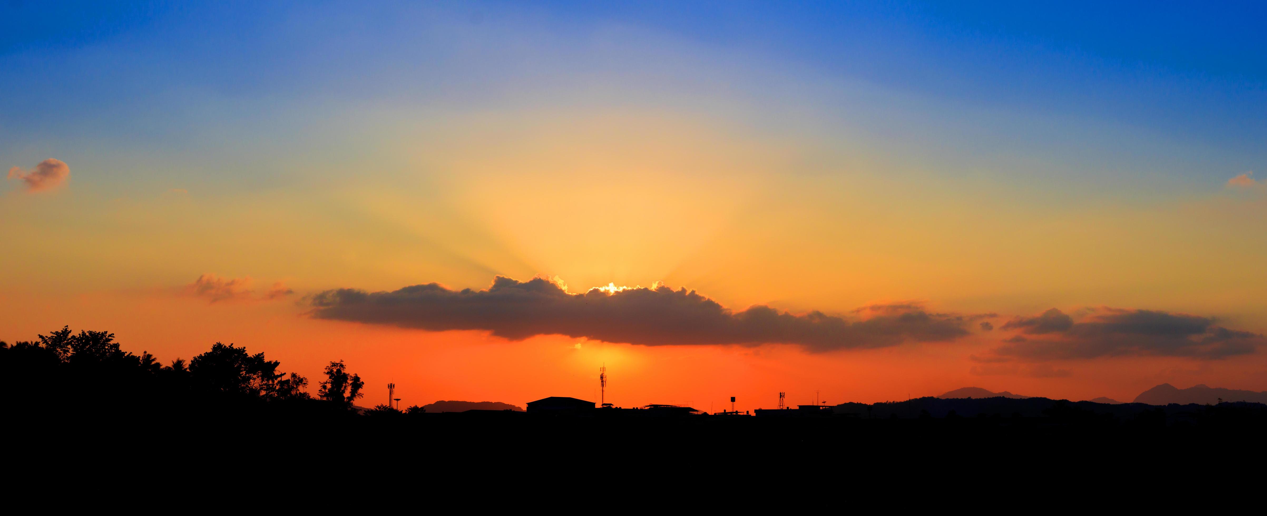 panorama view sunset in sky beautiful colorful landscape silhouette city countryside and tree woodland twilight time art of nature Stock Free