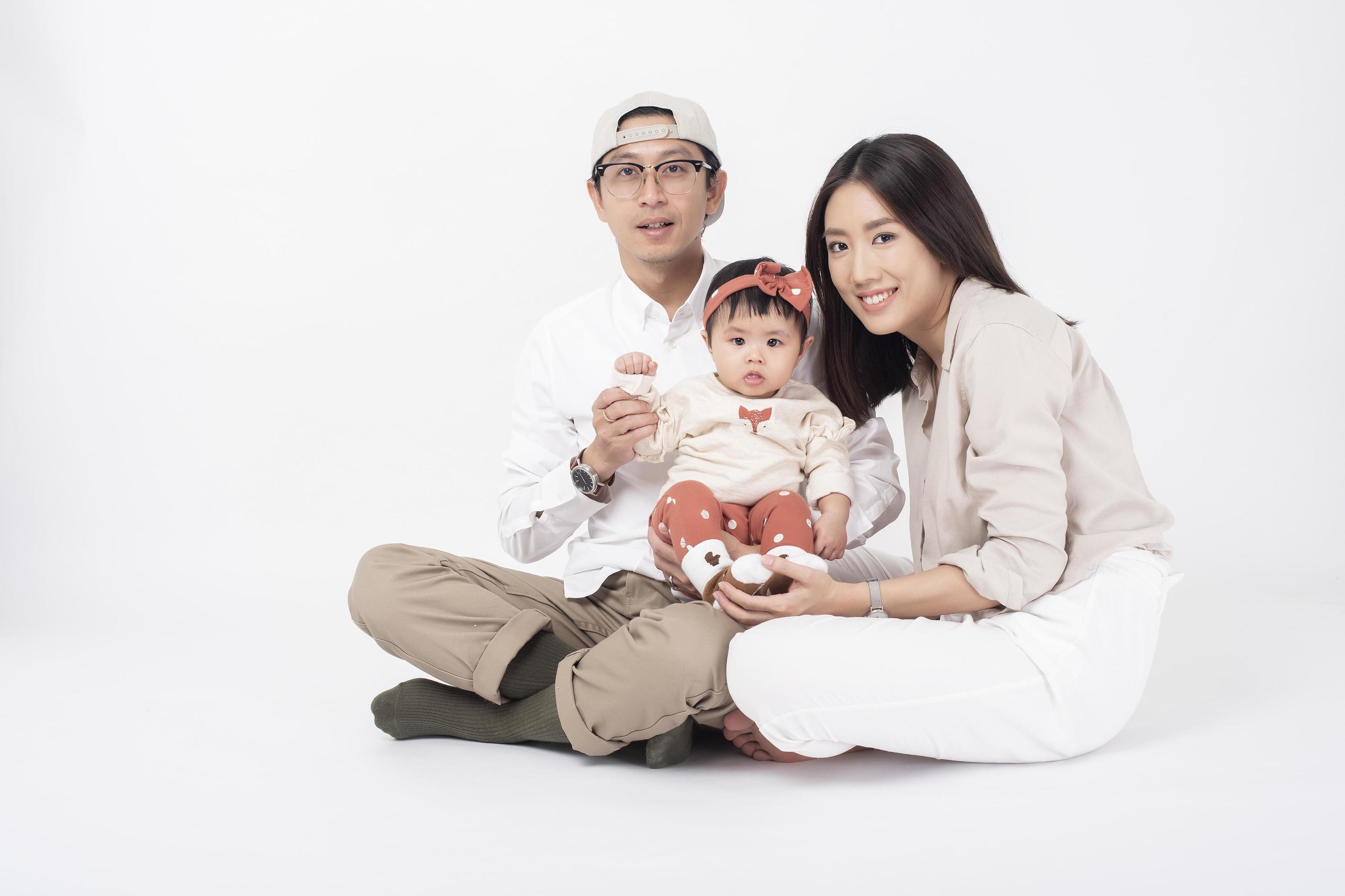 Happy Asian family on white background Stock Free