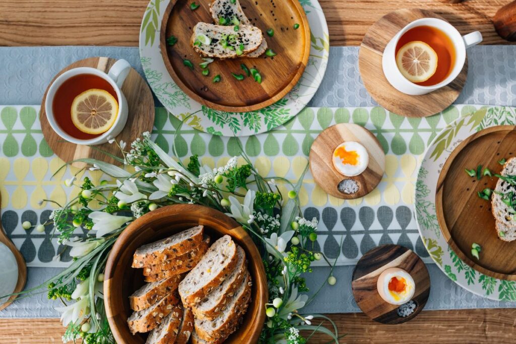 Breakfast served with tea, bread and eggs Stock Free