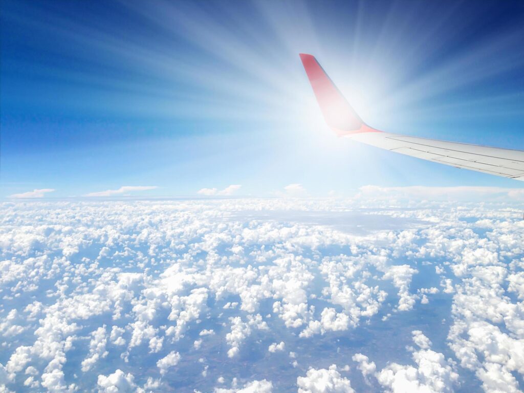 Winglet of airplane in the air during its flight with nice nature sky background Stock Free