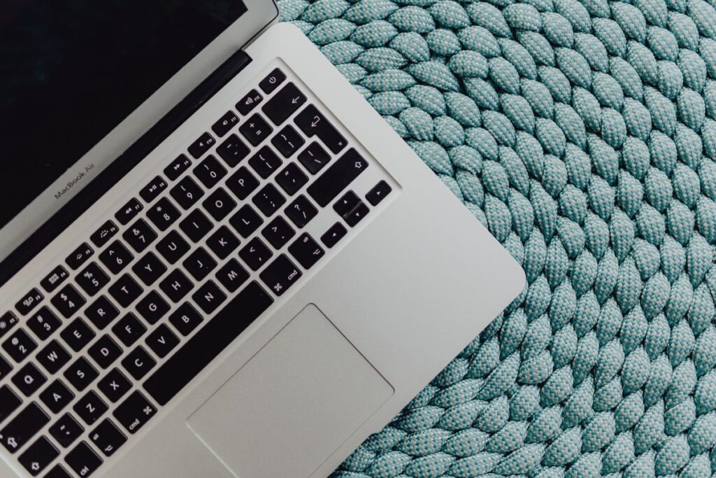 MacBook Laptop on a blue pouf Stock Free