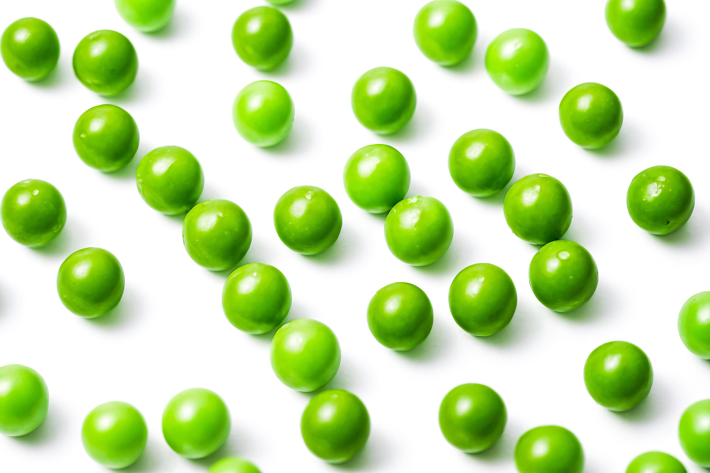 Green Peas Scattered on White Background Stock Free