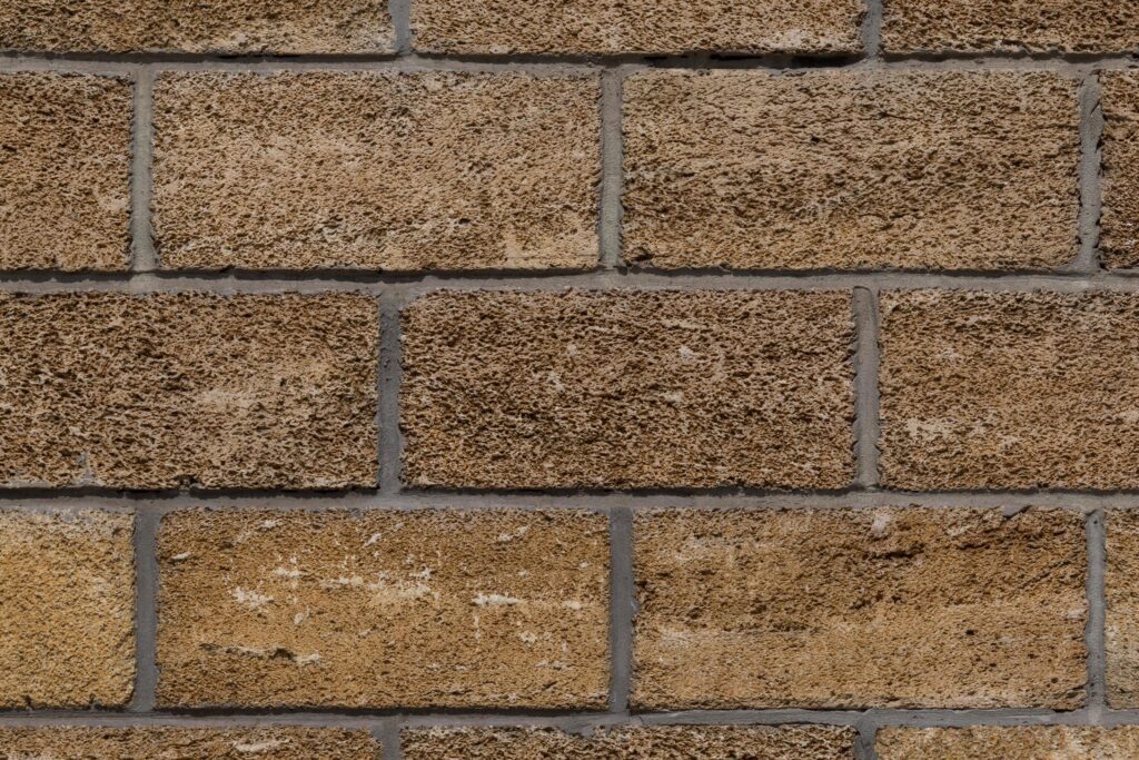 close up of wall made of shell rock bricks Stock Free