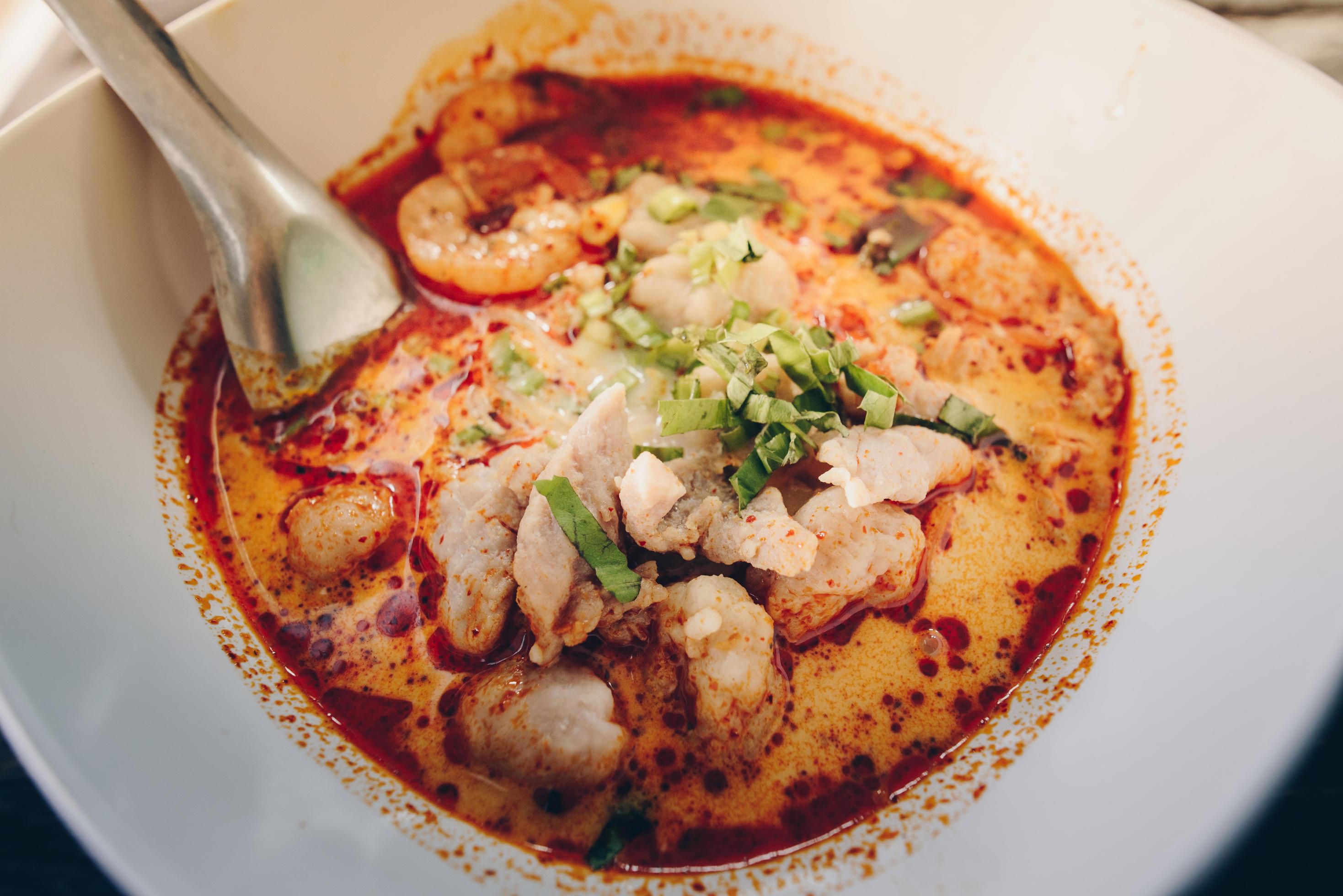 Tom Yum Goong mixed with meat ball noodles, Thai style and iconic popular taste of Thai foods. Stock Free