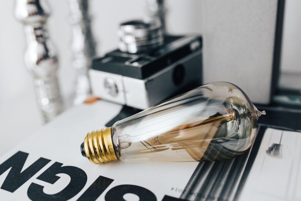 Pencils, magazines and an old lightbulb Stock Free