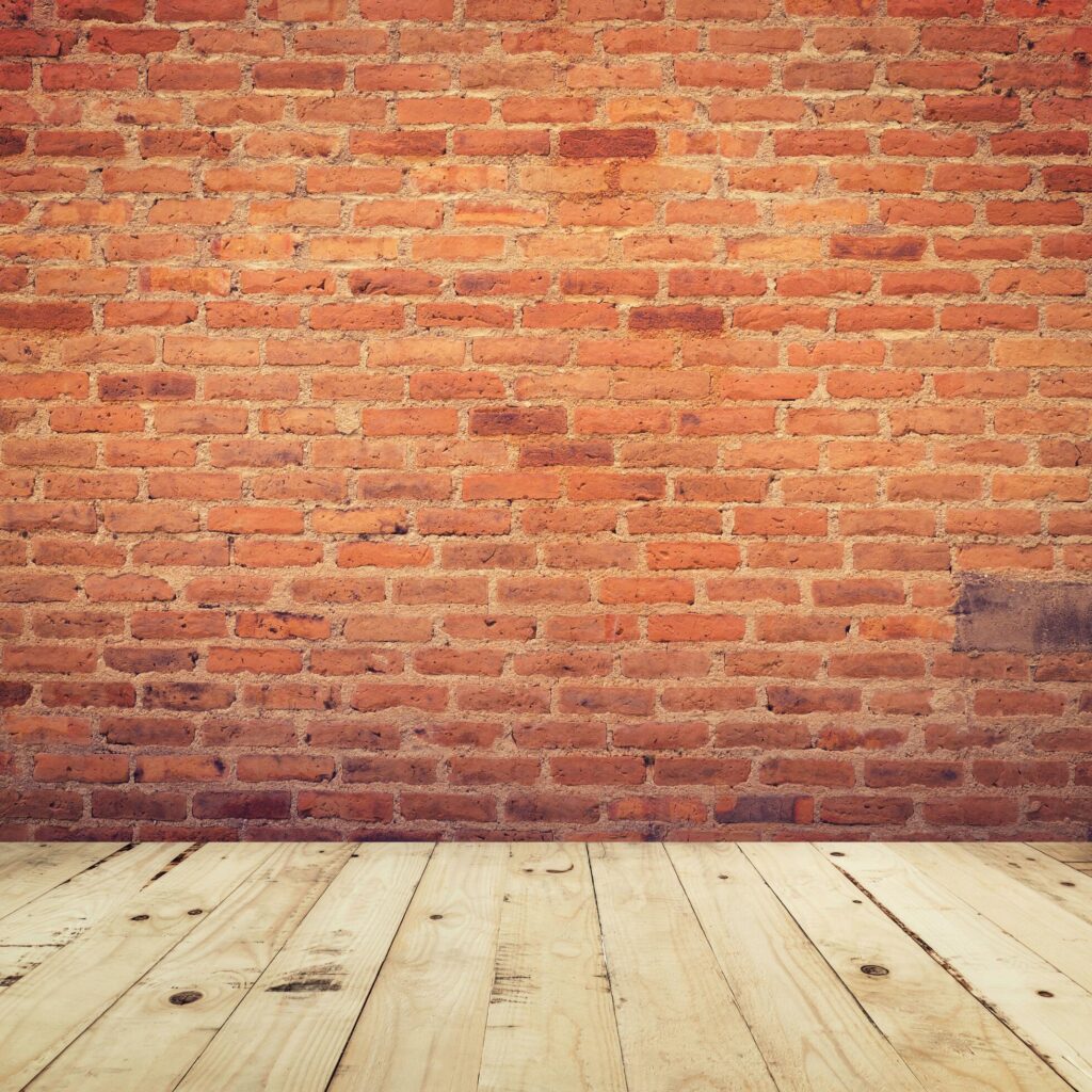 Old brick wall and wooden floor room background texture. Stock Free