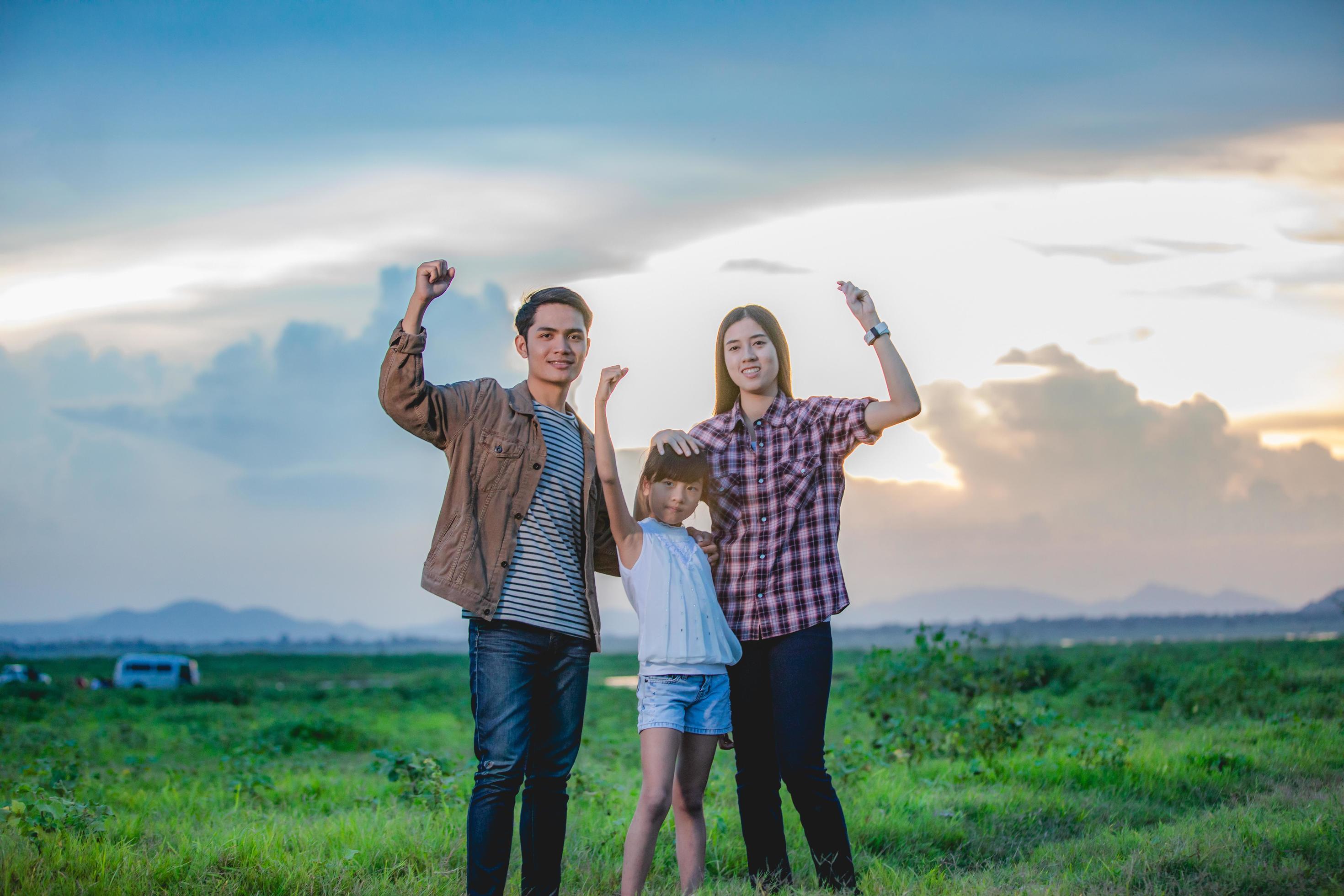 Happy little girl e with asian family enjoying road trip and summer vacation Stock Free