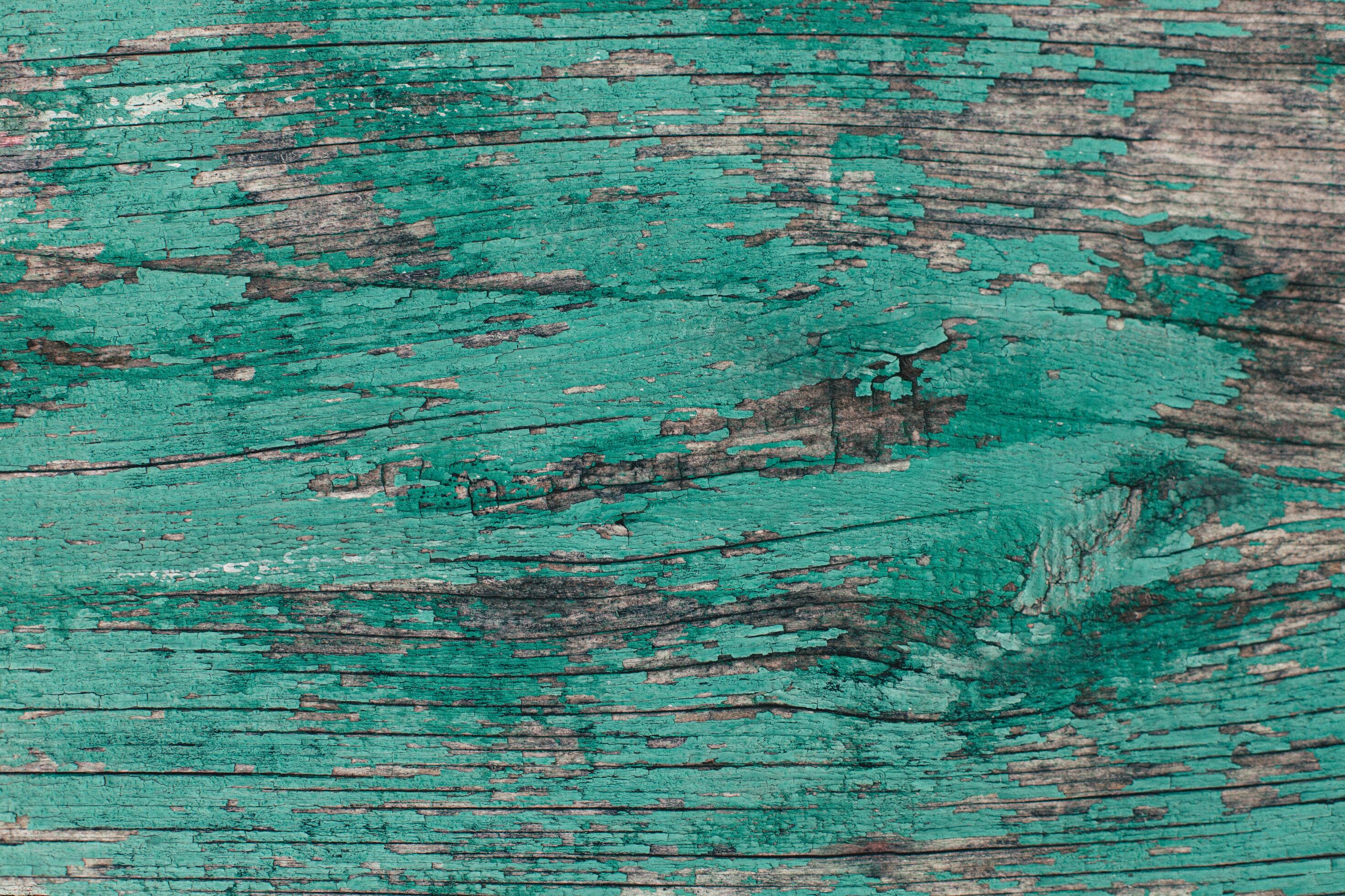 Rustic wood texture or background with turquoise paint. Stock Free